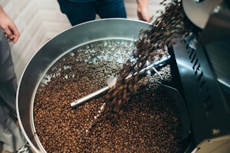 pouring coffee beans in bowl
