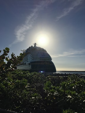 white cruise ship under ray of the sun
