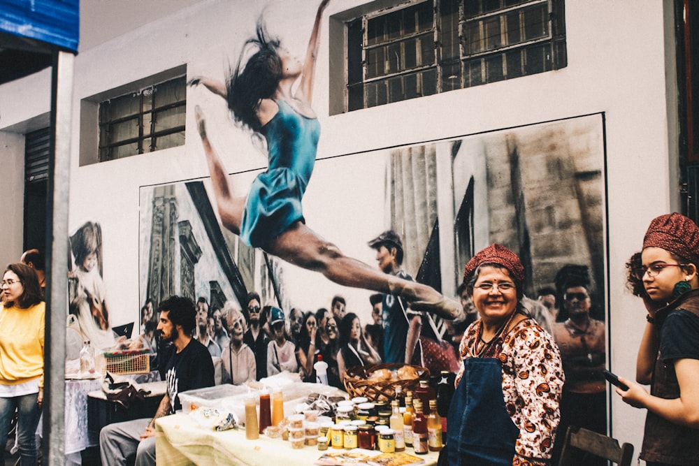 woman jumping over table