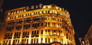 Elegant exterior of the hostel building bathed in golden evening light showcasing its royal charm