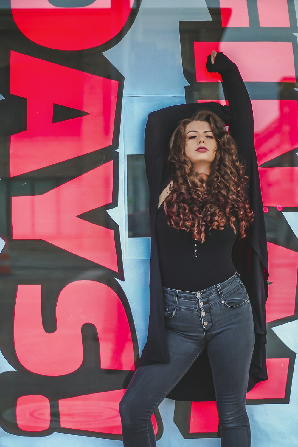 woman leaning on wall