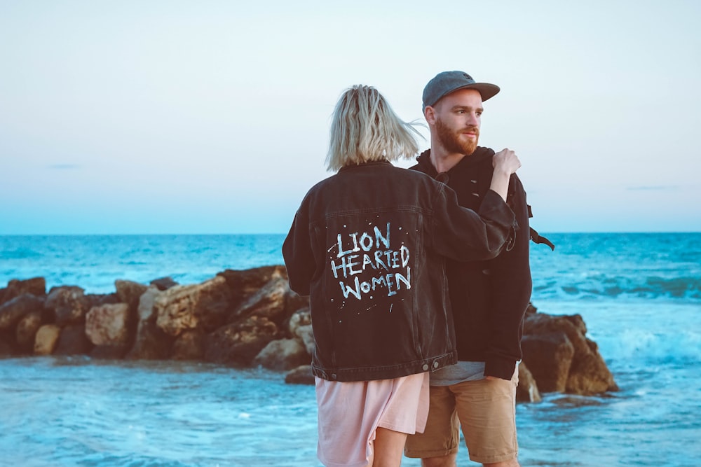 unknown persons standing near body of water