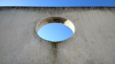 Detail of a 150mm diameter hole drilled through a concrete wall.