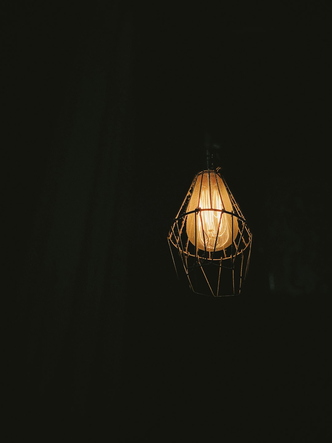 turned-on pendant lamp at dark room