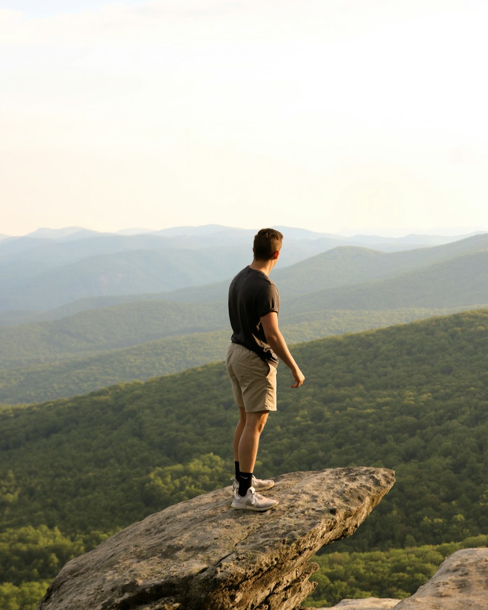 man standing on cliff