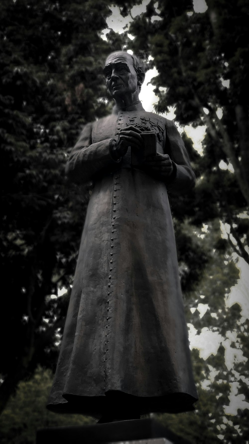 gray concrete man standing statue during daytime