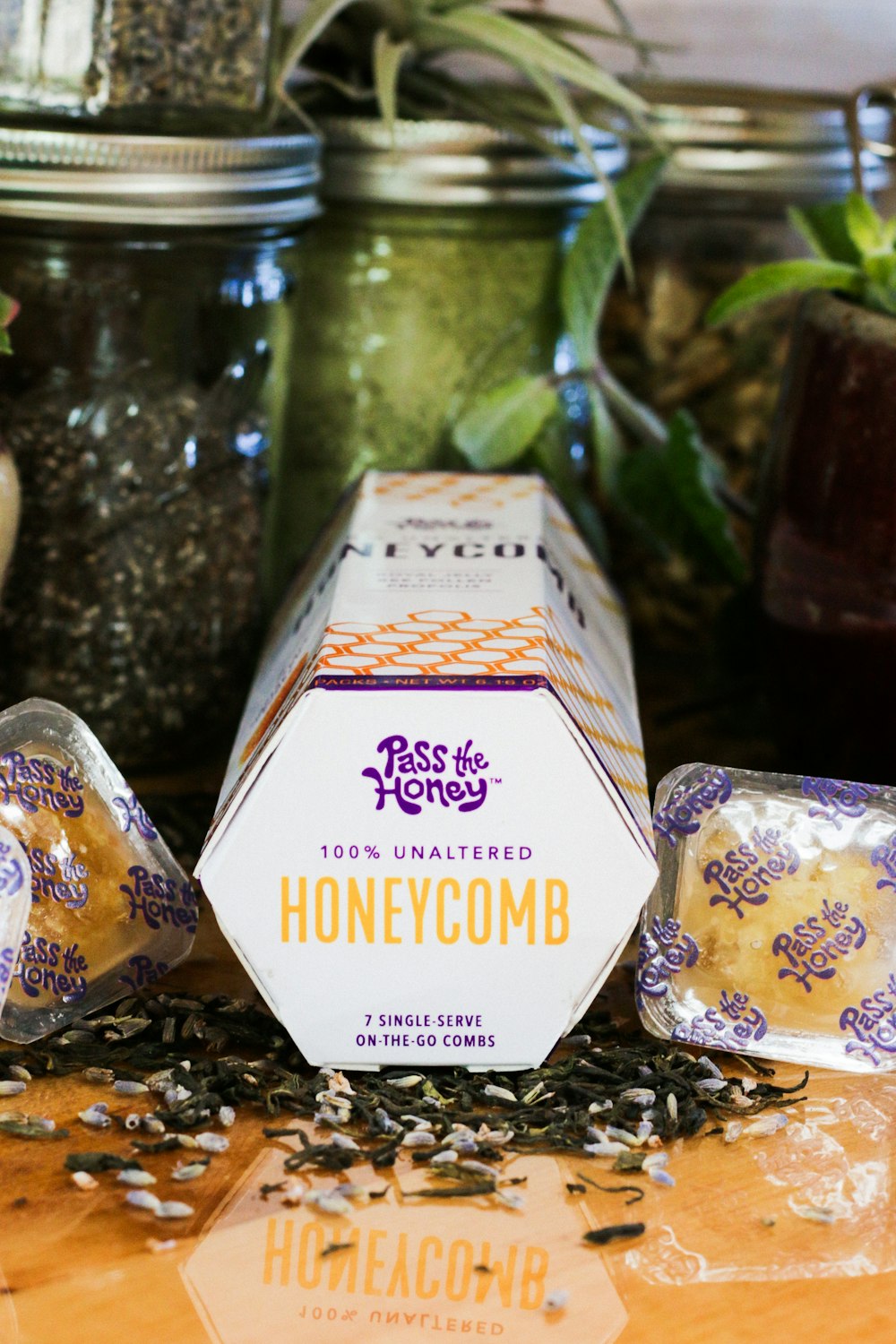 Pass the Honey honeycomb box across glass jars