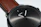 Close-up of a wrist wearing a modern, elegant watch with a minimalist design.