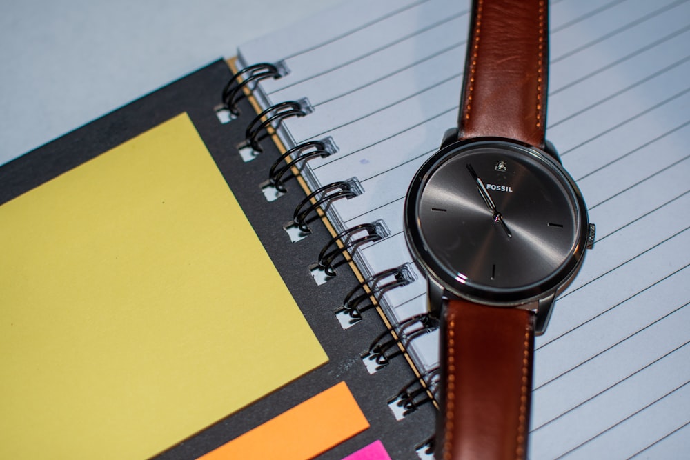 round gray Fossil analog watch with black strap