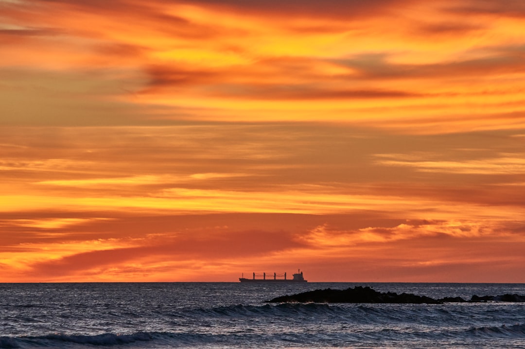 ship sailing during golden hour