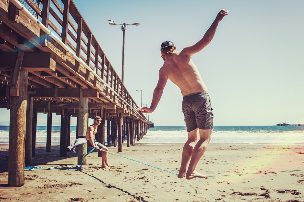 man balancing on rope