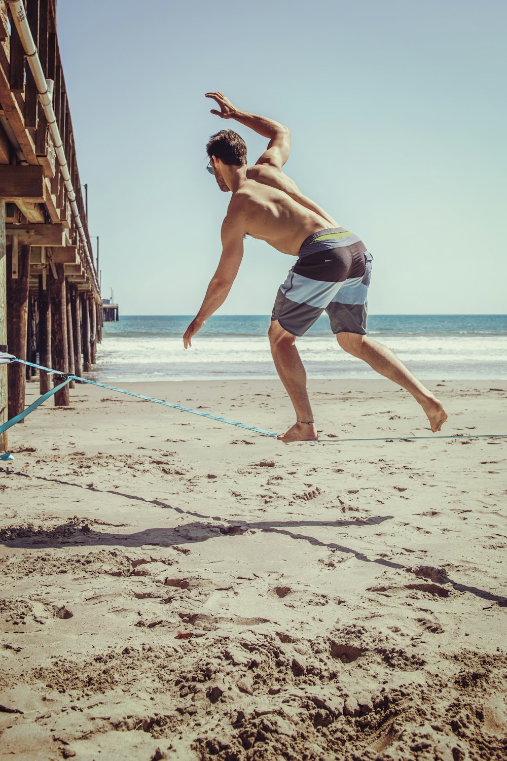 man standing at beach during daytime