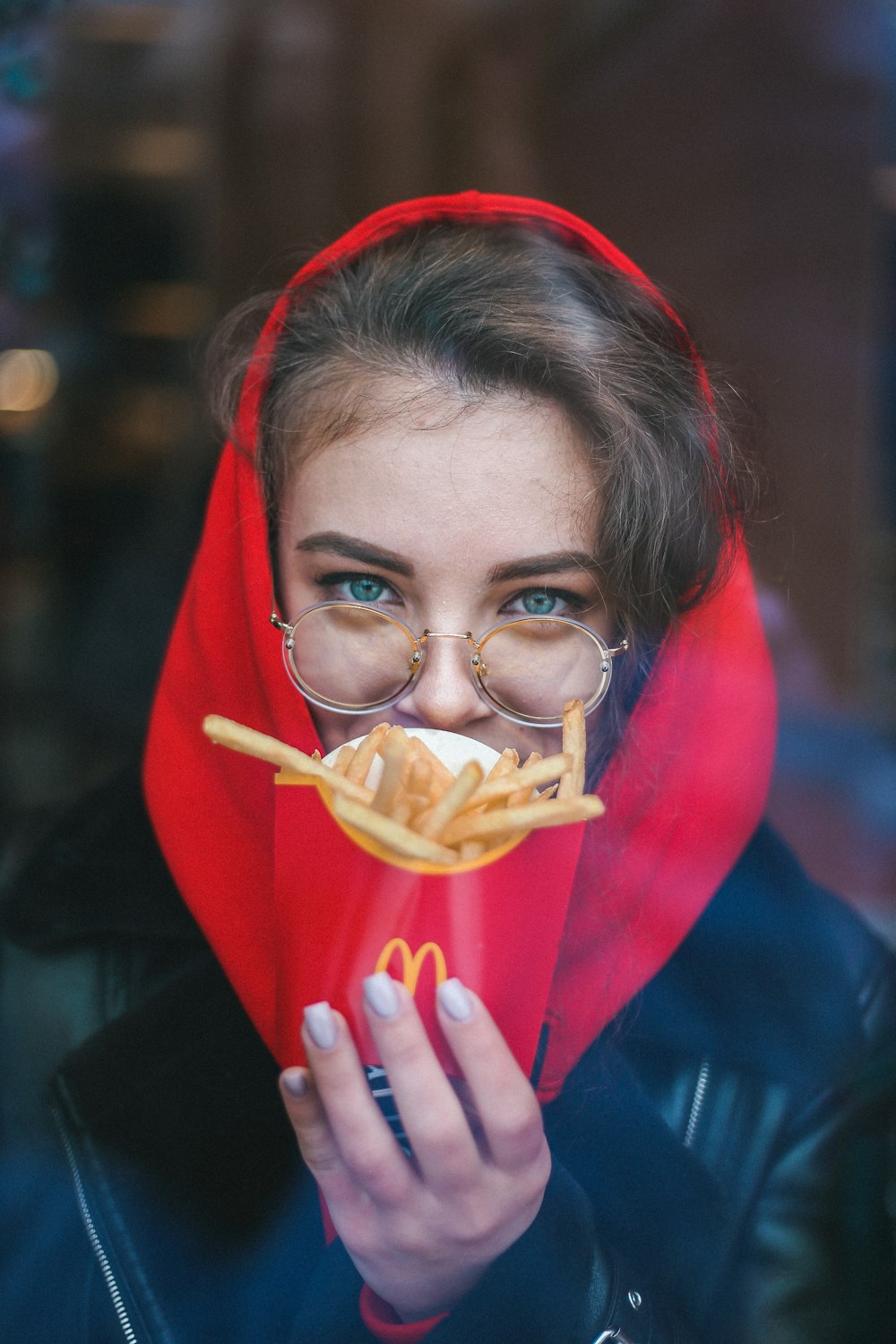 woman holding McDonald's fries