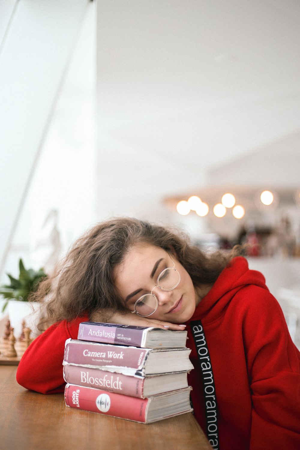 woman leaning on book