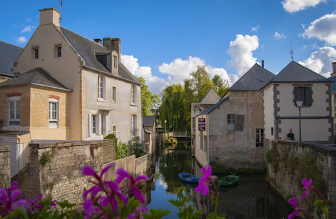 two kayaks on canal between houses