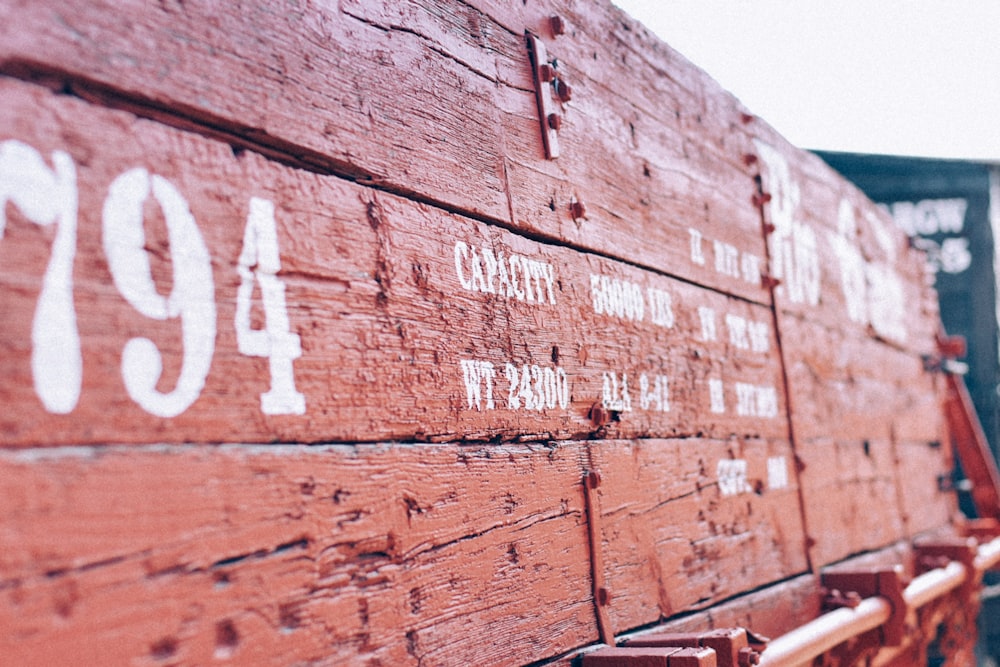 a close up of a wooden bench with numbers on it