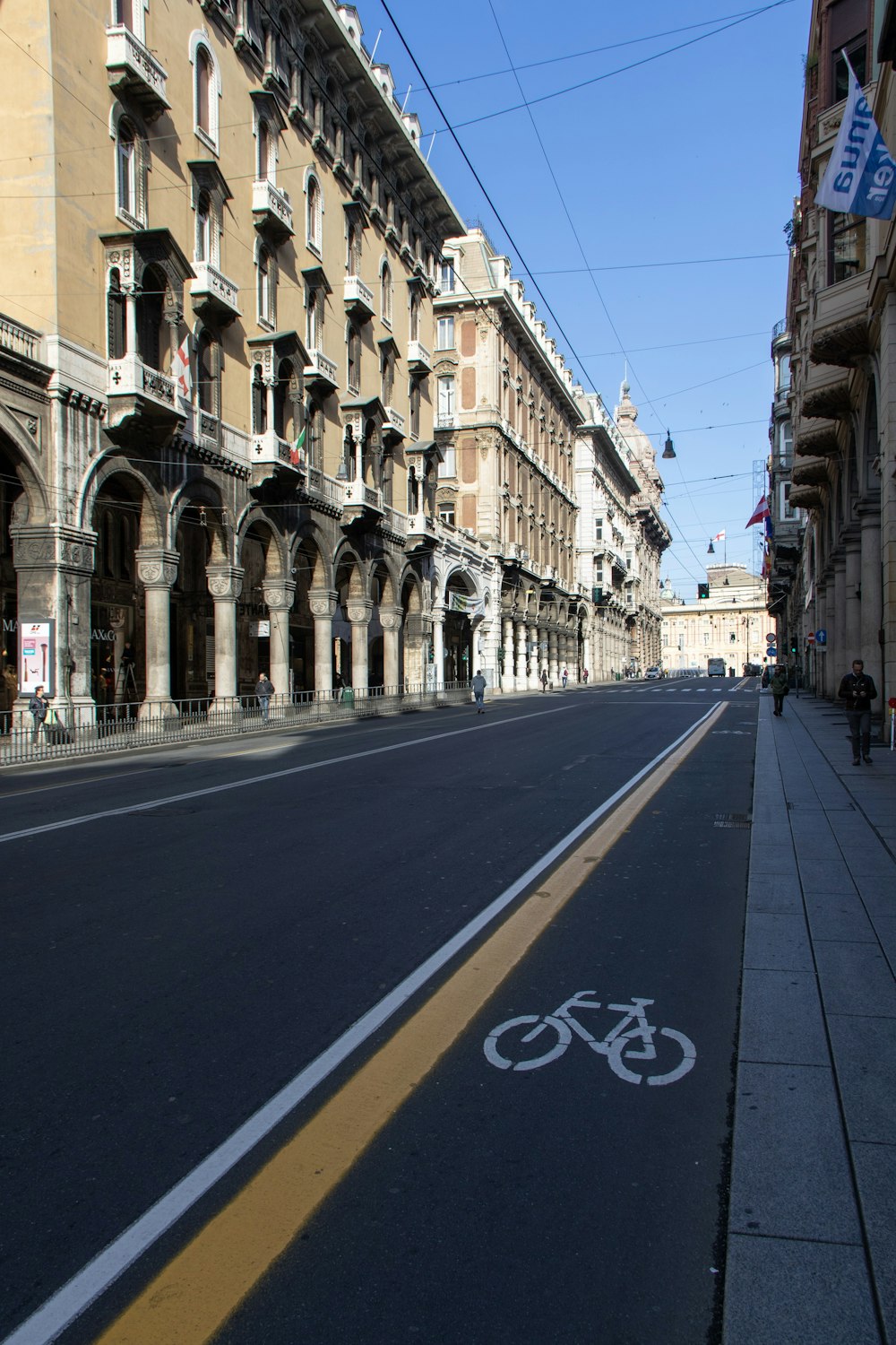 empty road between buildings during day