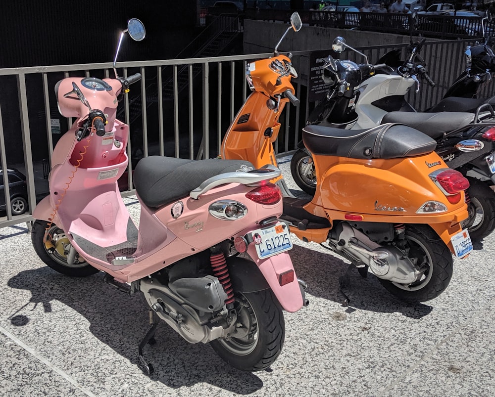 parked pink motor scooter