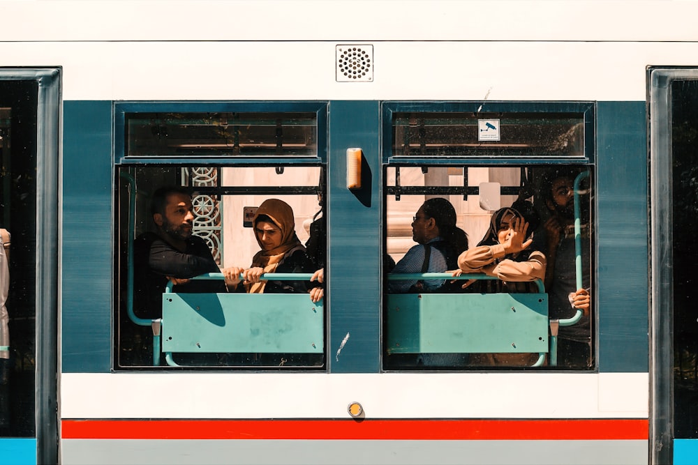 people riding on train