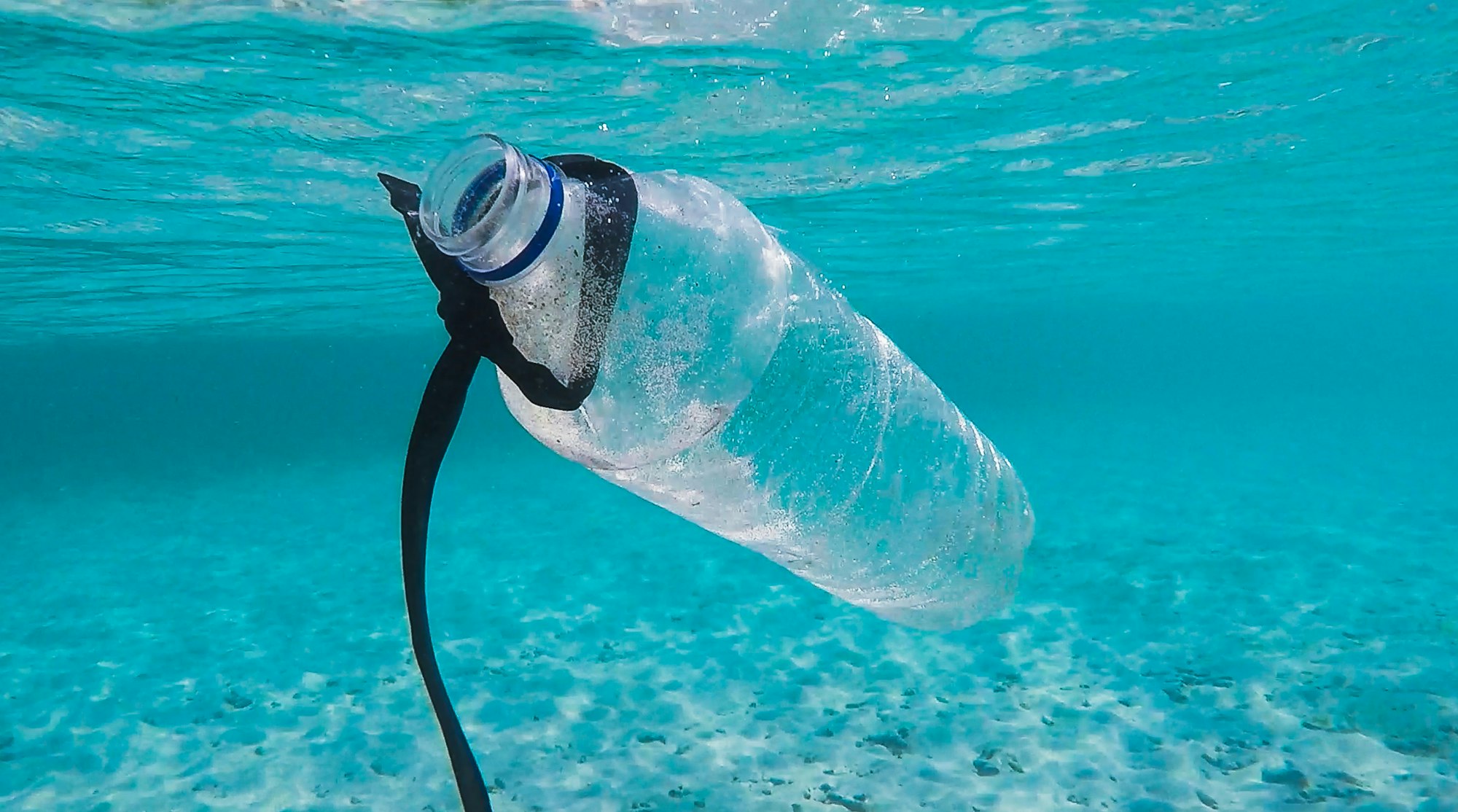 A plastic water bottle in the ocean