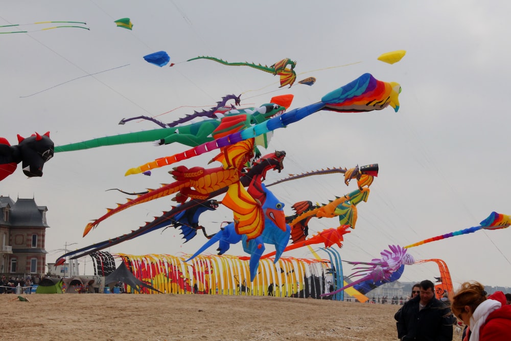 multicolored inflatable dragons at mid air
