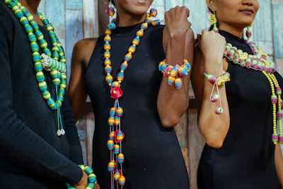 people wearing assorted-colored bead necklaces