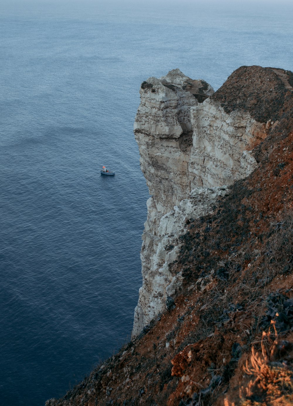 aerial photography of cliff near body of water during daytime