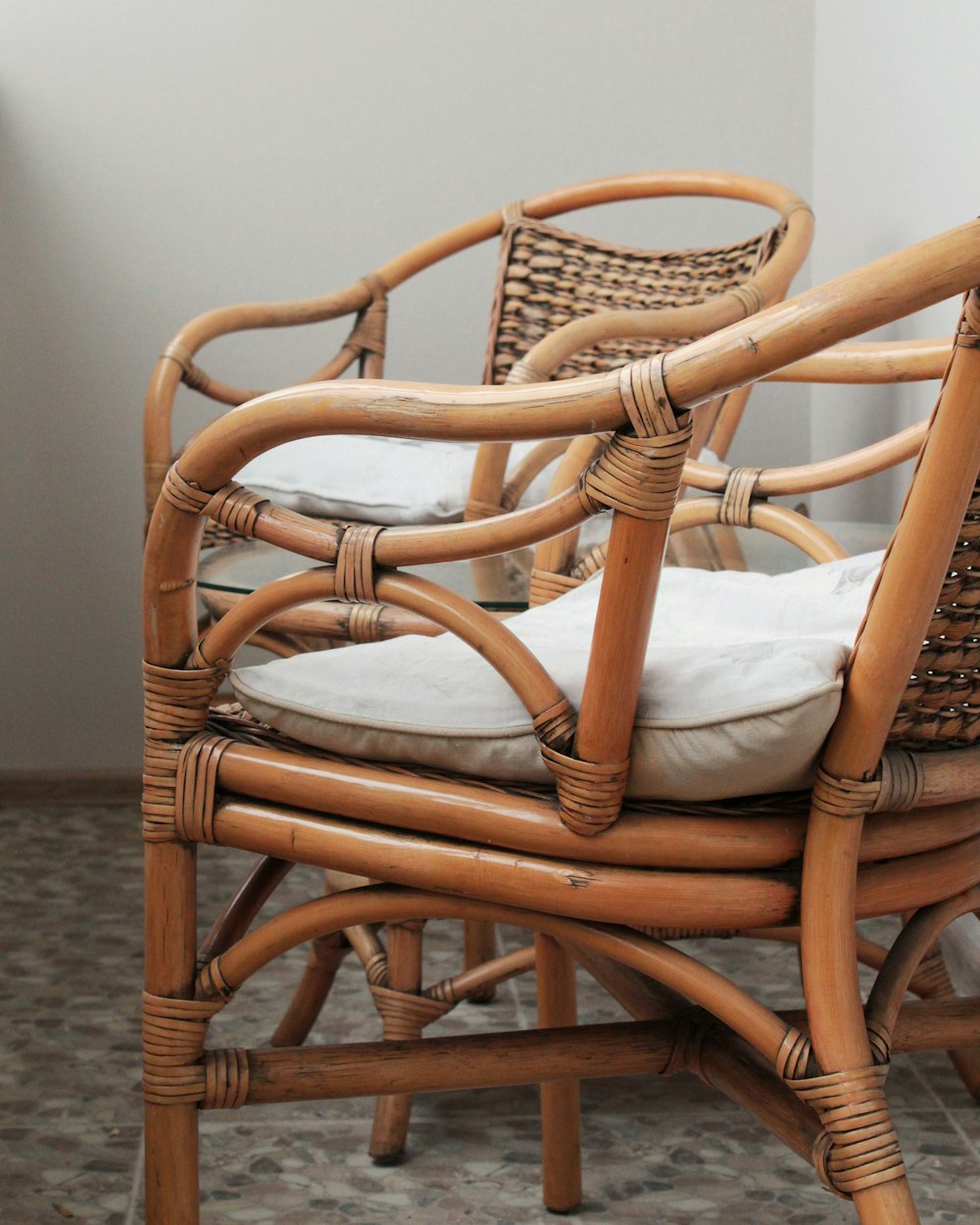 two brown rattan armchairs photo