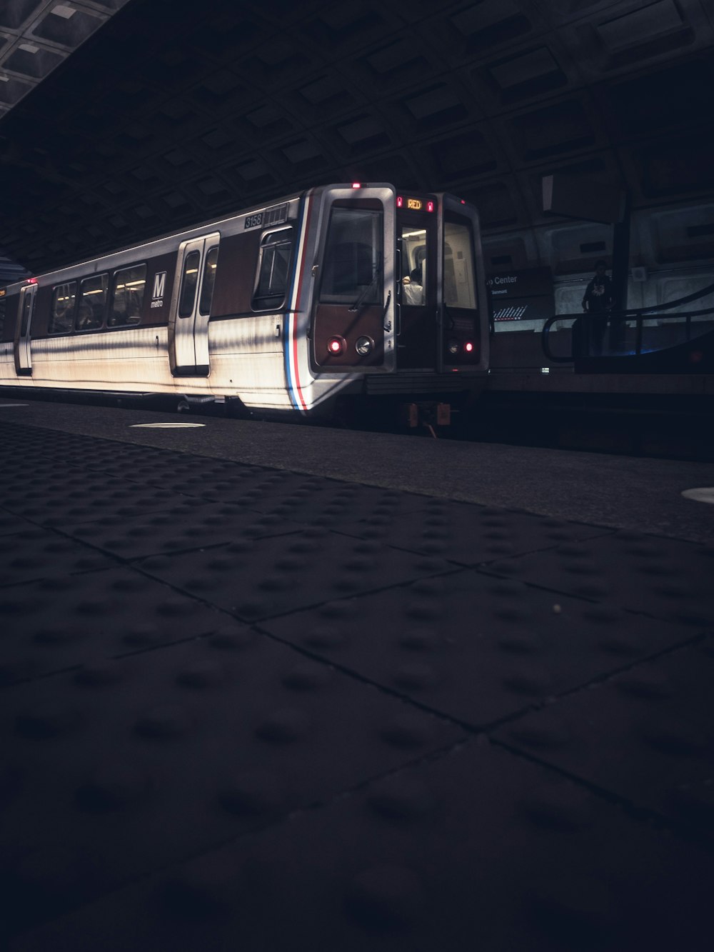 white-and-red train on station