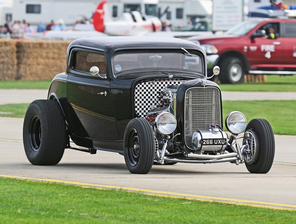 black coupe on road during daytime