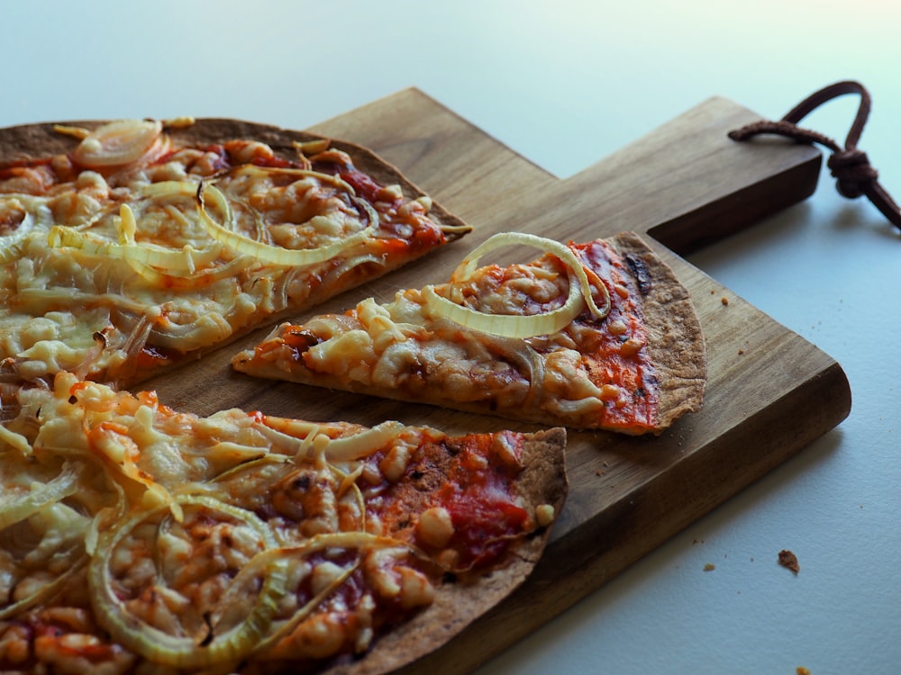 baked pizza pie on wooden tray