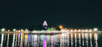 A serene temple festival illuminated by traditional lamps at dusk.