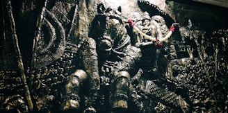 Indian deity riding horse statue
