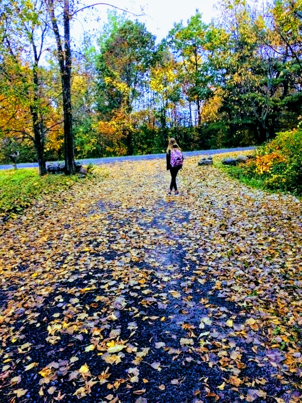 girl walking on road