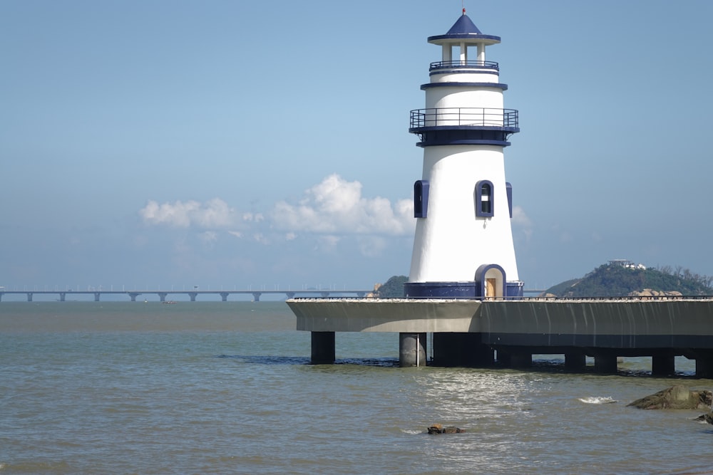 lighthouse on dock during day