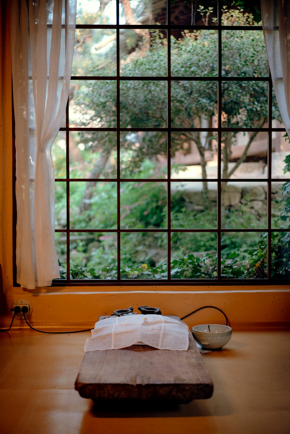 a suitcase sitting on the floor in front of a window