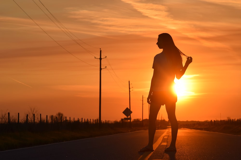 silhouette of woman during golden hour