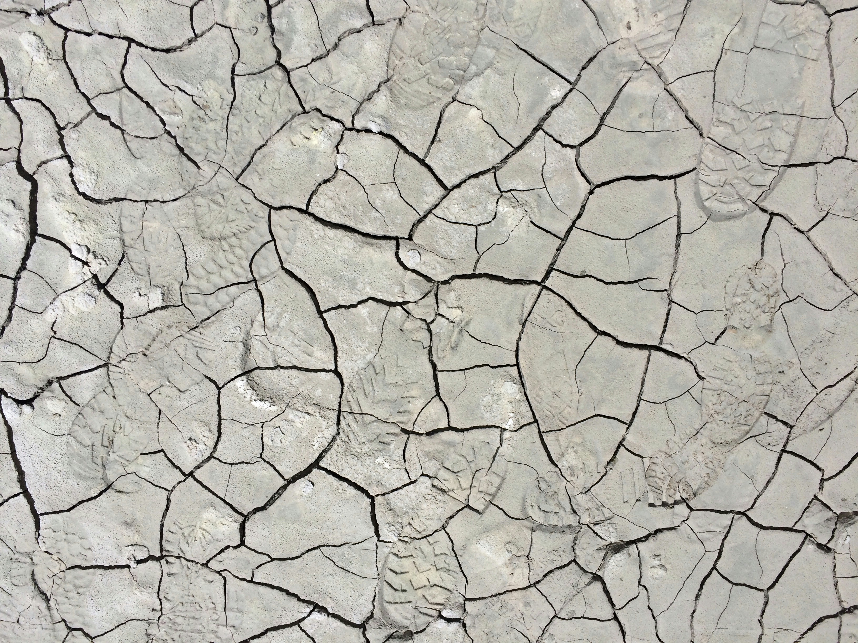 a cracked white surface with cracks in it