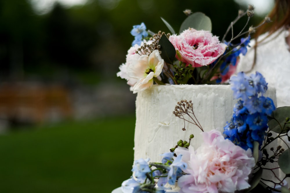 a close up of a cake with flowers on it
