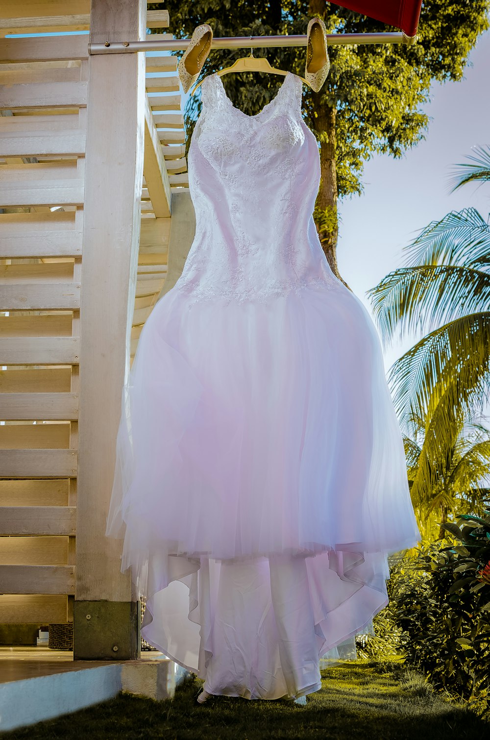 white tank wedding dress hanged