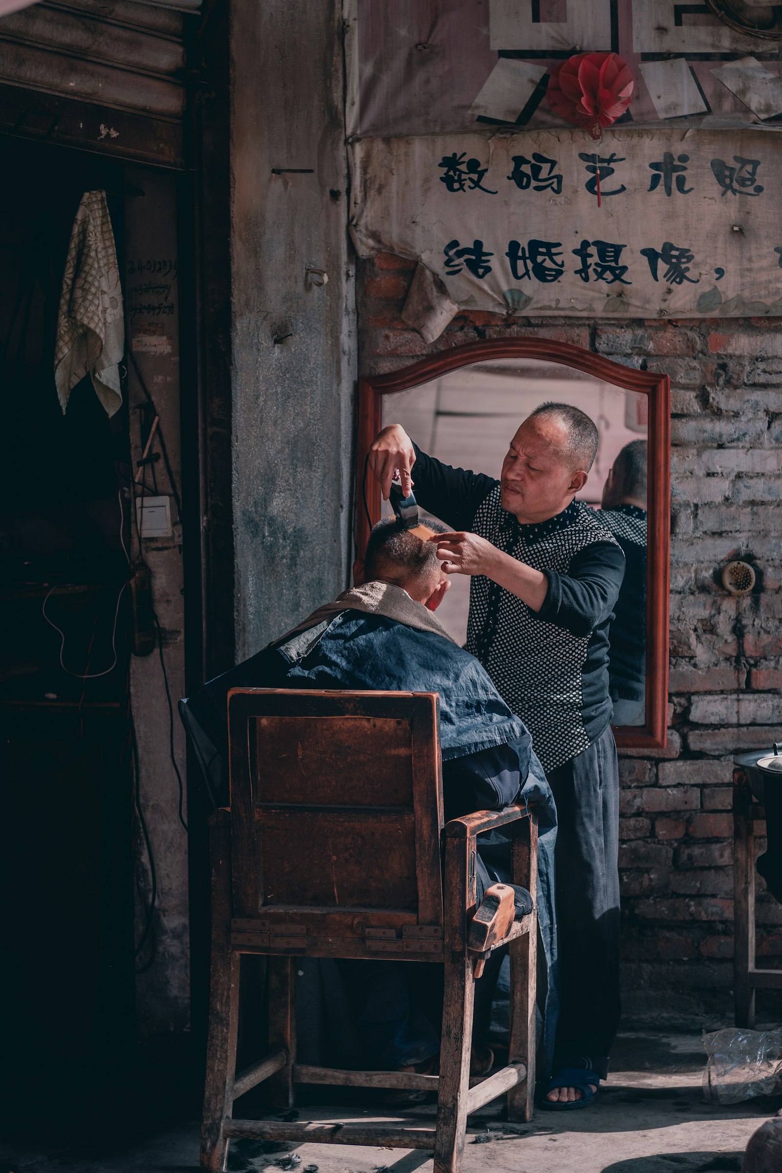 Sony a7 III sample photo. Barber cutting hair of photography