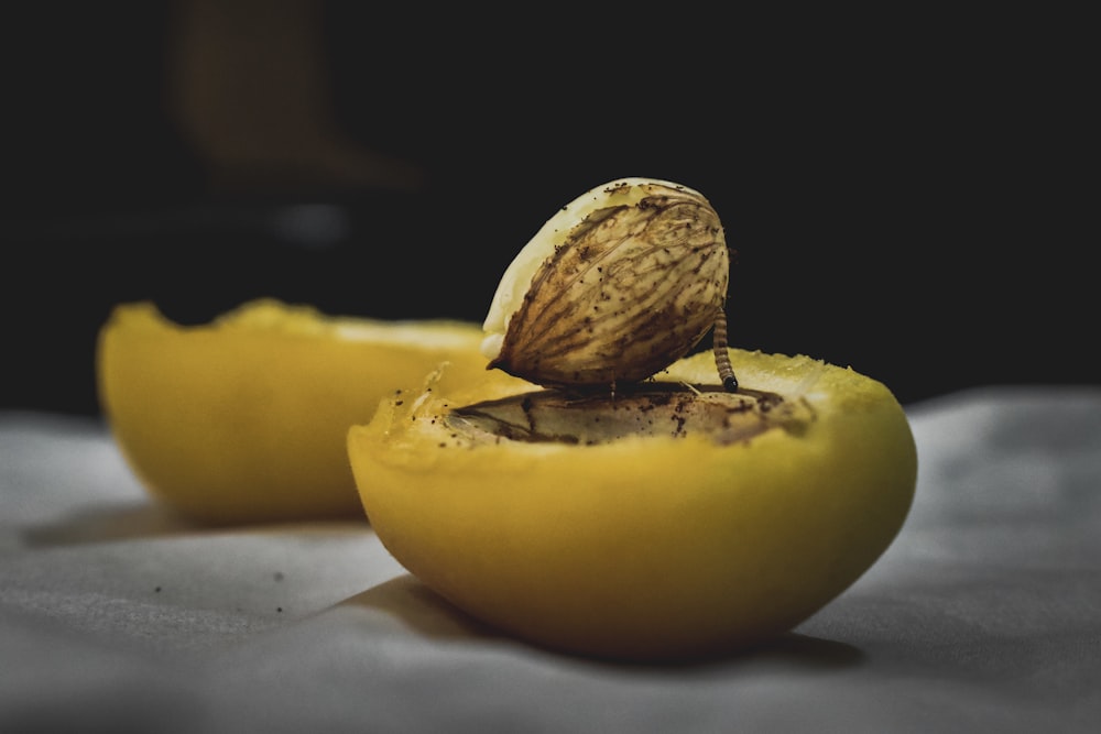 nut on top of sliced lemon
