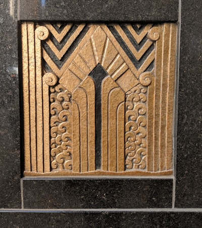 Modern architectural detail symbolizing strength and protection with dark tones and gold accents.