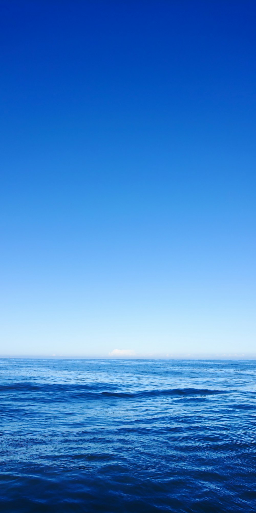 ocean water under clear blue sky