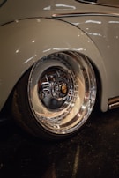 Close-up of a car’s polished wheel and tire, reflecting the care wcars puts into every vehicle.