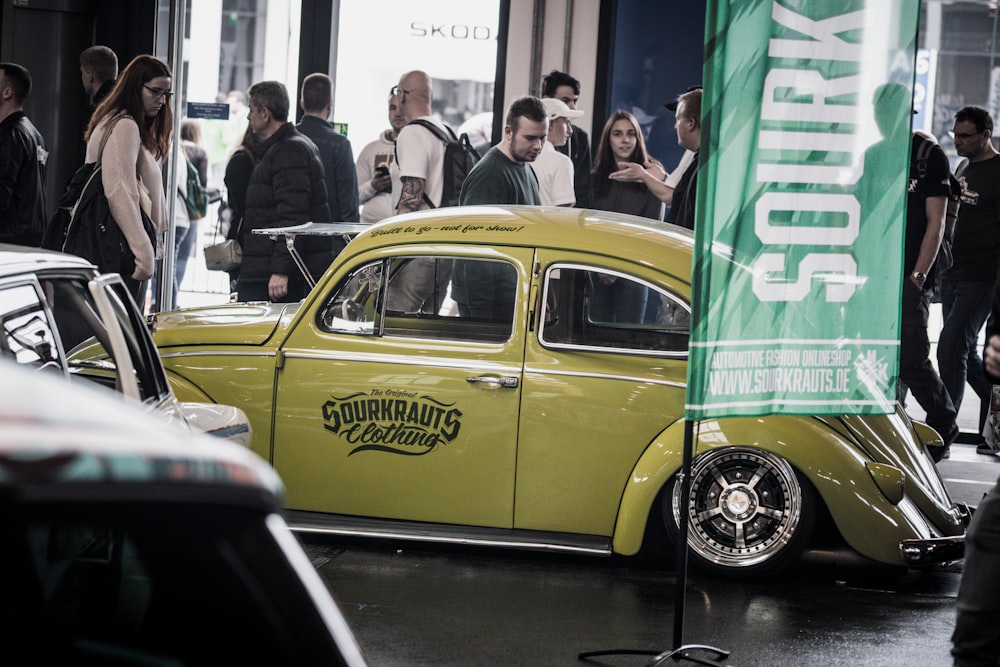 yellow classic Volkswagen Beetle on display