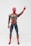 A detailed action figure of a superhero in a red and dark blue armored suit, featuring intricate gold lines across the chest. The figure is posed with one hand raised and some fingers extended, expressing a dynamic stance.