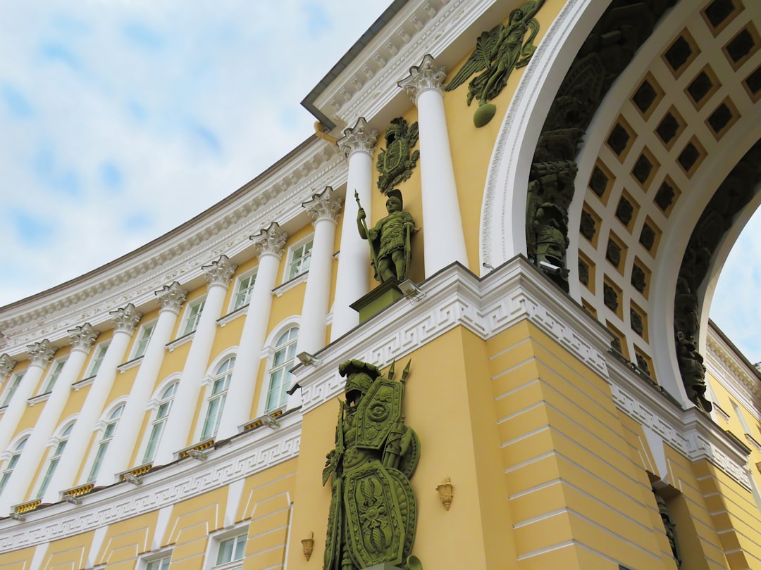low angle photgraphy of yellow and white buildings, The Palace Square in Petersburg.