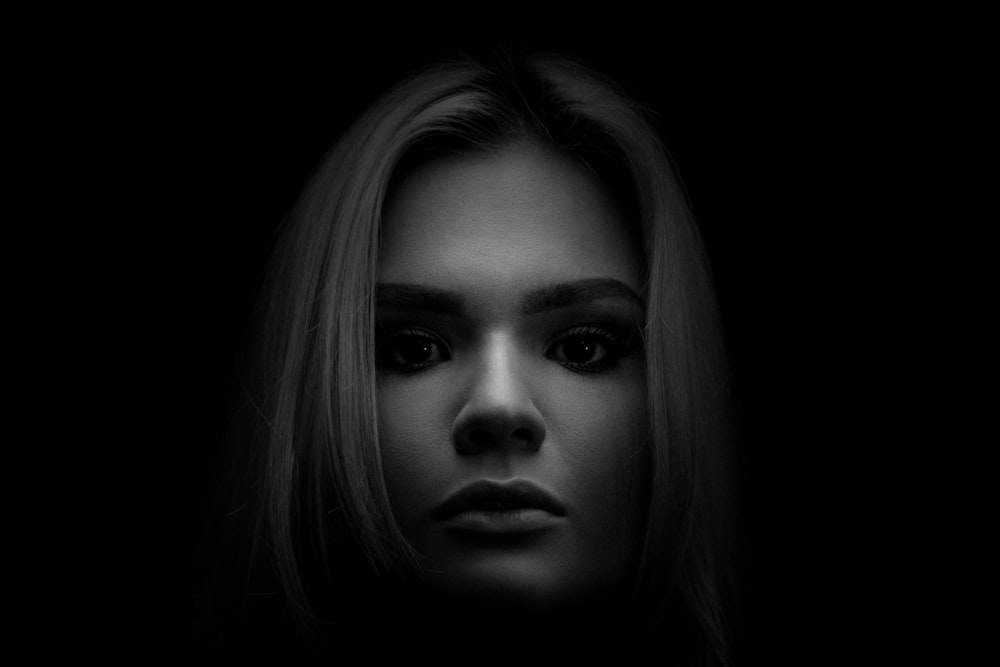 grayscale photo of woman's face