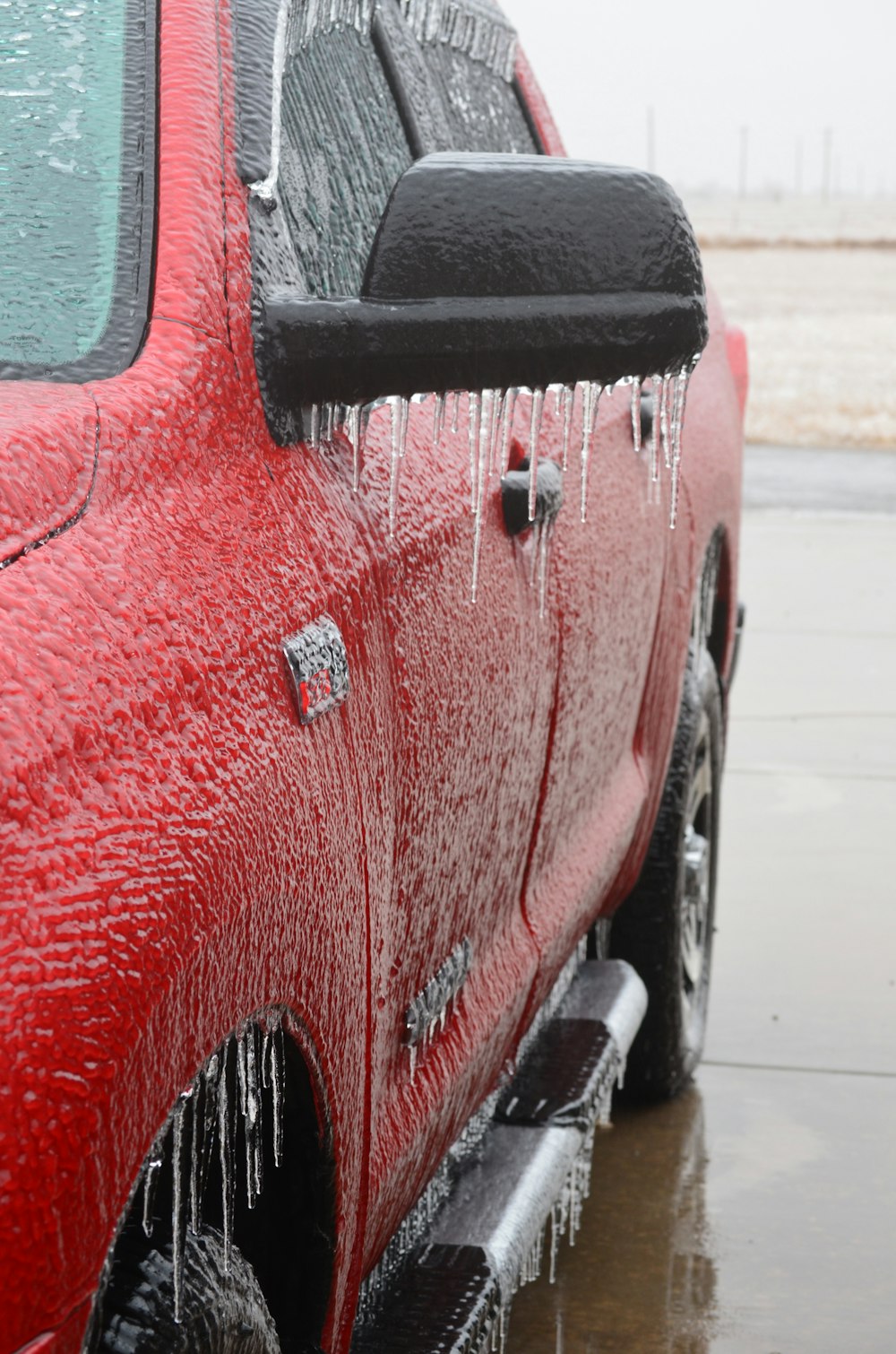 frozen red crew cab pickup truck